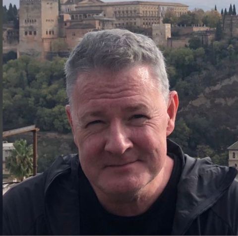 Aidan O'Leary, creator of Ulysses Companion, with the Alhambra in the background.